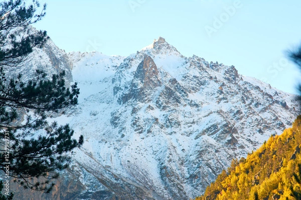 Obraz Stunning autumn scenery of famous alp peak Matterhorn capped by snow and yellowed larches on foreground. 