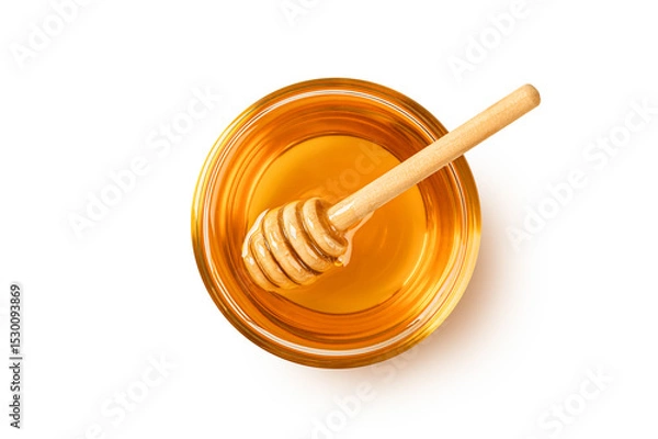 Obraz Glass of honey with honey dipper isolated on white background. Top view

