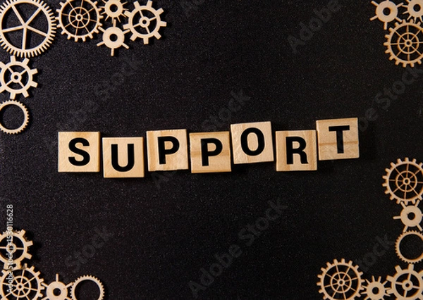 Fototapeta Team Holding Building Blocks Spelling out Support.