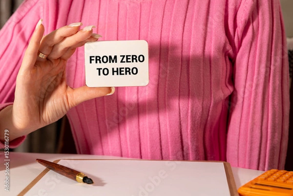 Fototapeta girl holds a card with the text From zero to hero
