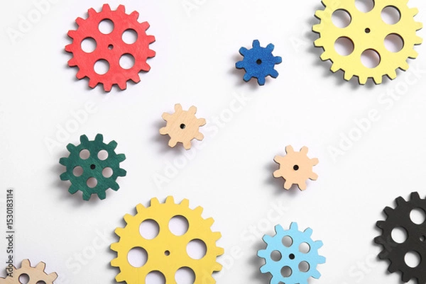 Fototapeta Wooden gears on white background