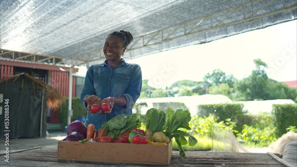 Fototapeta Portrait of woman with a tray of fruit and vegetable, enjoying a day of learning