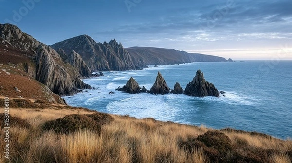 Fototapeta Dramatic coastal scenery with rugged cliffs and crashing waves.
