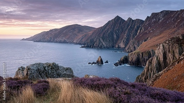 Fototapeta Dramatic coastal landscape with rugged cliffs and a tranquil sea.