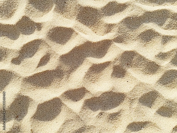 Fototapeta Close-Up View of Soft Sand Texture with Natural Patterns and Shadows
