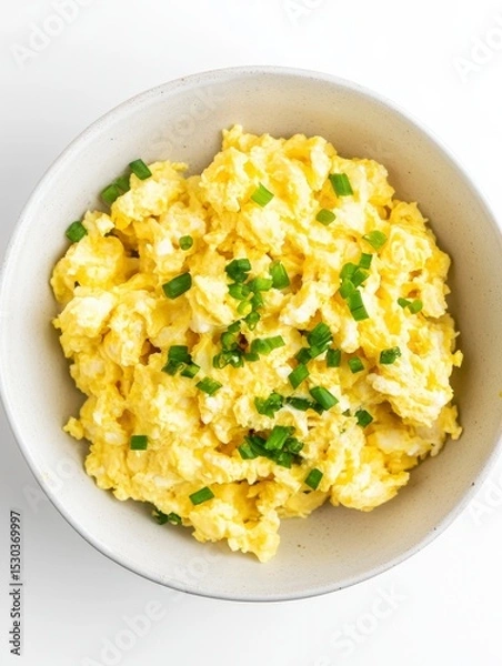Fototapeta Creamy Scrambled Eggs with Chopped Green Onions in White Bowl