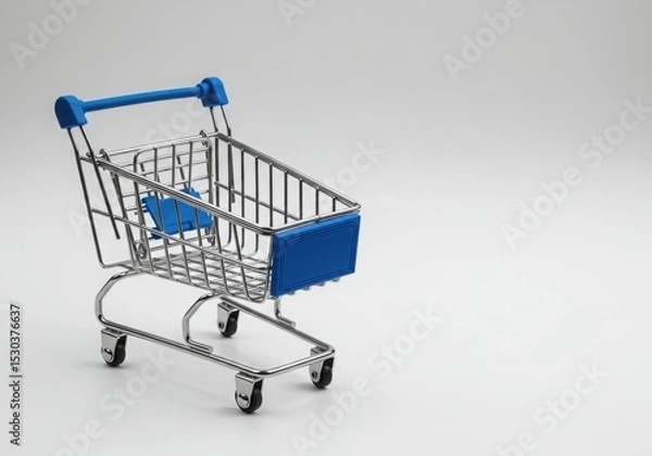 Obraz Miniature shopping cart with blue accents on a plain background