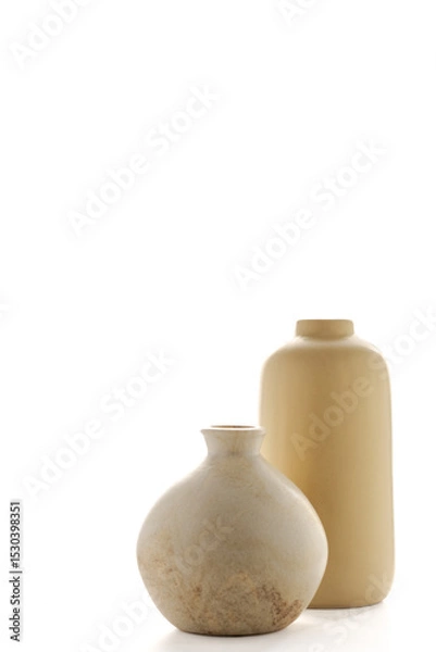 Obraz Vertical image of two modern minimalist vases in soft sand tones, backlit with bright white light. The elegant simplicity and neutral palette