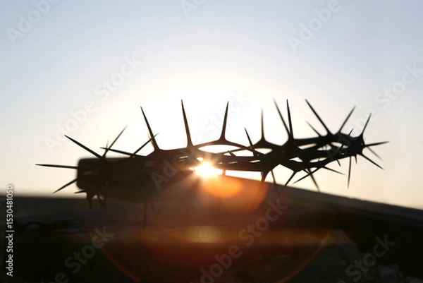 Obraz Crown of thorns and red sunset silhouette symbolizing the sacrifice and suffering of Jesus Christ on the cross, Holy Week and Lent background

