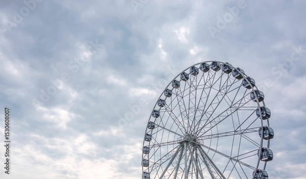Obraz Ferris wheel on a summer day, close-up.