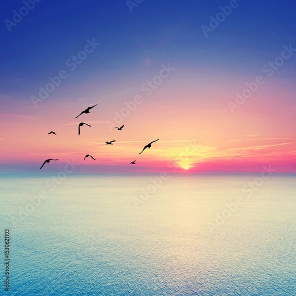 Fototapeta beautiful Endless Mediterranean Beach at Sunrise with Vibrant Summer Colors and Birds Soaring Above the Horizon