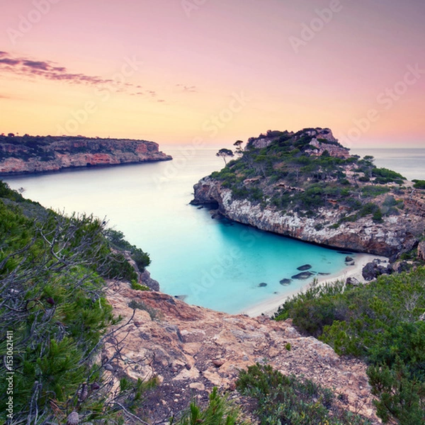 Fototapeta Breathtaking Turquoise Bay Between Cliffs on Mallorca at Sunrise