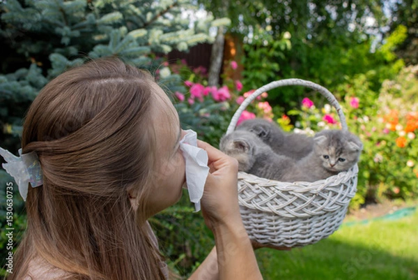 Fototapeta Woman Sneezing from Cat Allergy in Garden