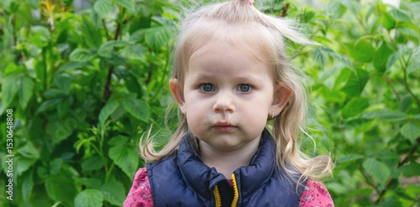 Fototapeta The little girl has snot. Spring allergies