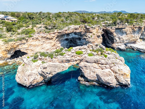 Fototapeta Natural arch Es Pontas near Cala Santanyi on Mallorca island in the Mediterranean sea in Spain