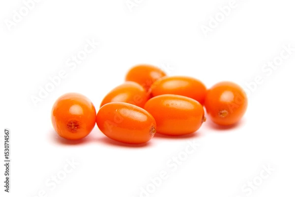 Fototapeta A small group of bright orange sea buckthorn berries with a smooth, glossy surface, isolated on a white background. Rich in antioxidants and used in health foods