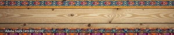 Fototapeta Vibrant patterned border decorates a rustic wooden wall, adding a pop of color and texture to the simple background Perfect for home decor, DIY, and craft projects , surface, modern, retro