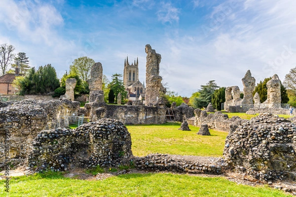 Fototapeta A view of the Abbey ruins and the cathedral at Bury Saint Edmunds on a bright day in springtime