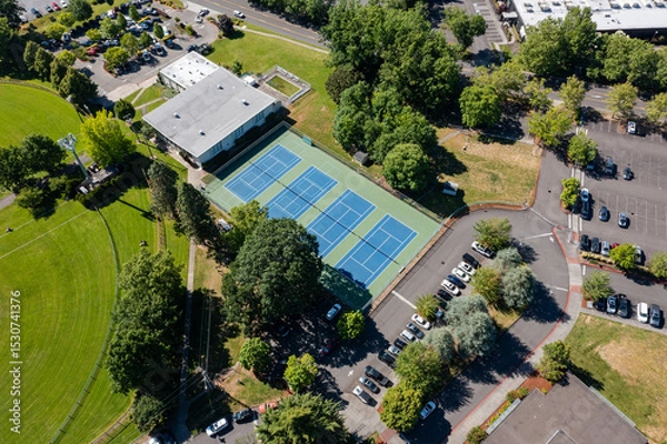 Obraz High resolution aerial drone picture of outdoor tennis courts and green fields near a high school in Cedar Mill, Portland, Oregon, captured on a clear summer day	
