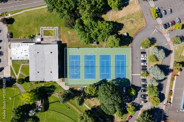 Obraz High resolution aerial drone picture of outdoor tennis courts and green fields near a high school in Cedar Mill, Portland, Oregon, captured on a clear summer day	
