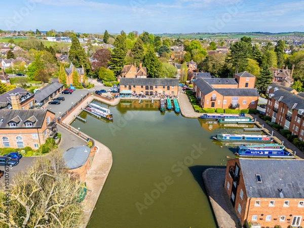 Fototapeta An aerial view from the canal towards the canal basin in the town of Market Harborough, UK on a bright day in springtime