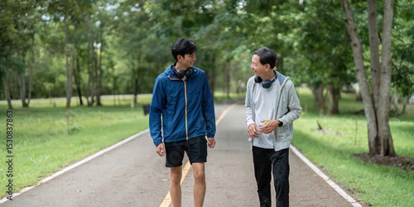 Fototapeta Father and Son Walking Together, Promoting Wellness and Connection
