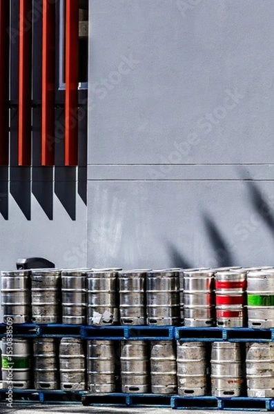 Obraz Beer kegs stored outside a hotel.
