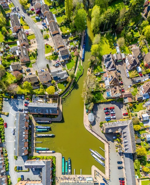 Fototapeta An aerial view directly above the canal and the canal basin in the town of Market Harborough, UK on a bright day in springtime