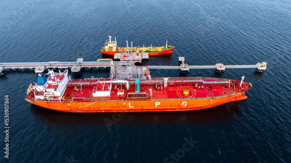 Fototapeta Aerial view LPG gas tanker ship at oil and gas terminal platform, Liquefied Petroleum Gas tanker ship industrial offshore oil gas terminal tanker ship LPG tanker ship loading arm loading and unloading