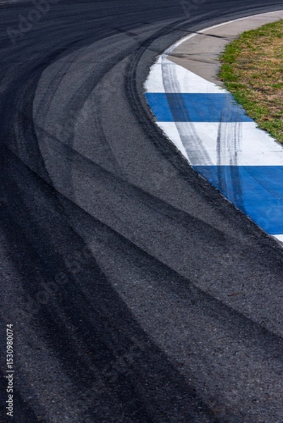 Fototapeta Car tire mark on race track, Abstract black car tire mark on race track, Abstract texture background car tire mark skid mark on asphalt circuit, Tire track on road race speed track circuit.