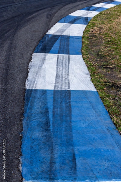 Fototapeta Car tire mark on race track, Abstract black car tire mark on race track, Abstract texture background car tire mark skid mark on asphalt circuit, Tire track on road race speed track circuit.