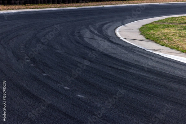 Fototapeta Car tire mark on race track, Abstract black car tire mark on race track, Abstract texture background car tire mark skid mark on asphalt circuit, Tire track on road race speed track circuit.