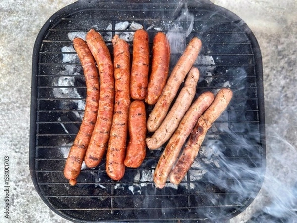 Obraz Saucisses sur un barbecue 