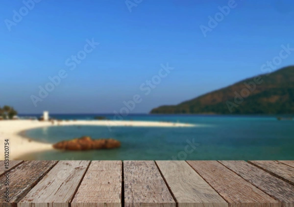 Obraz Wooden table top on the beach or sea.Party on the beach  sunshine time concept.For montage product display or design key visual layout.View of copy space.