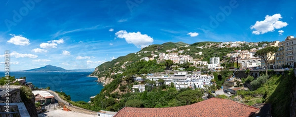 Fototapeta Panoramic view of the city of Vico Equense with Vesuvius and the blue waters of the Gulf of Naples. Italy