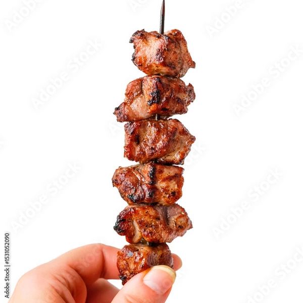 Obraz Succulent meat cubes on a skewer, grilled to perfection. A handheld culinary delight, ready to be enjoyed. Isolated on black.