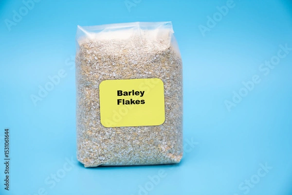 Fototapeta Barley Flakes Packed with beta-glucans; supports cholesterol reduction and heart health. cereal in a bag