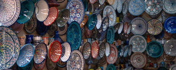Obraz Moroccan ceramic plates, traditional pottery and market culture, local shop in Marrakech’s Medina, vibrant souks filled with traditional Moroccan detailed patterns and cultural artistry
