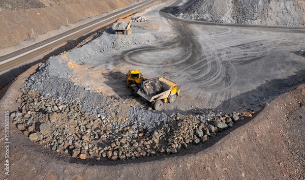 Obraz Industrial excavator loader of gold ore to truck, mining industry, Aerial top view