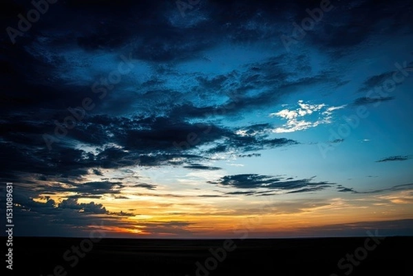 Fototapeta Dramatic sunset sky with dark clouds