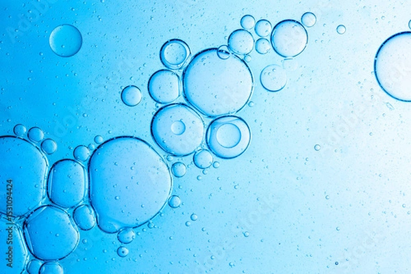 Fototapeta Close-up blue science experiment bubble texture,Bubbles in clear liquid, water or gel texture, oil drop, beauty collagen serum, hyaluronic essence skin care smear, aqua purity, abstract background.
