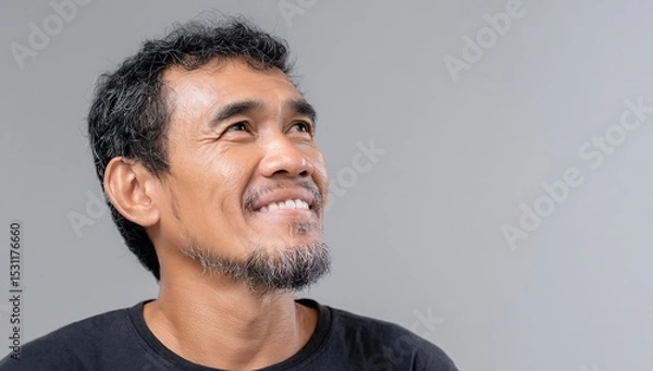 Fototapeta Man Looking Upward With A Smile