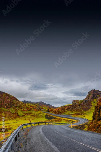 Fototapeta Cover page with a paved road, Ring road, through rough and colorful Icelandic landscape, Iceland, summer, dramatic scene, copy space