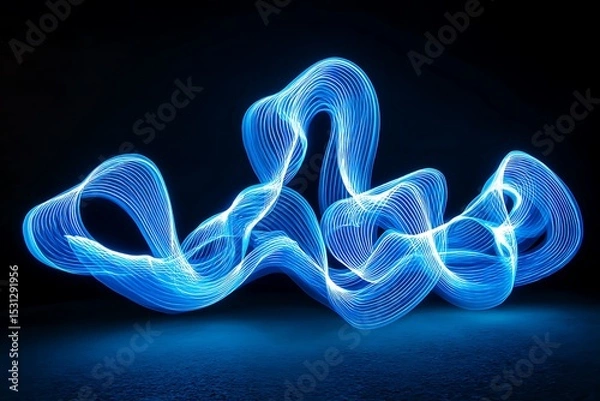 Obraz Electric blue light trails swirl across a dark background, forming a stunning abstract light effect that conveys both movement and calm.