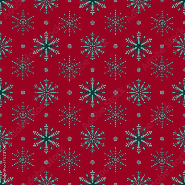 Fototapeta Red background with a repeating pattern of blue and green snowflakes arranged in a festive, symmetrical design.