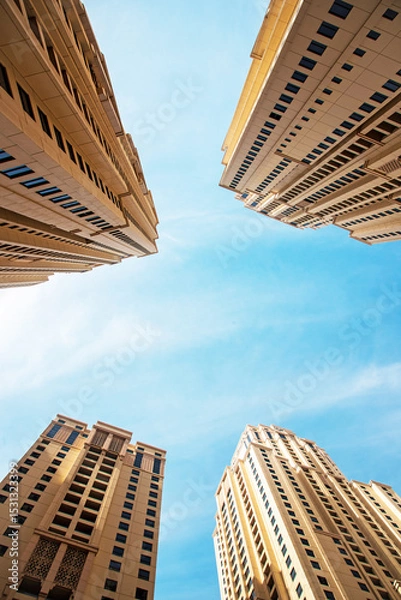 Fototapeta Abstract architectural image with skyscrapers on sky background.