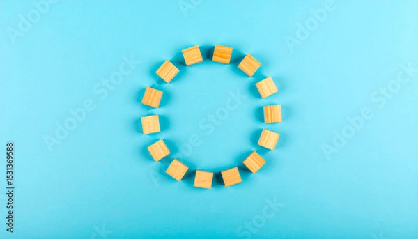 Obraz Wooden Blocks Forming Circle on Blue
