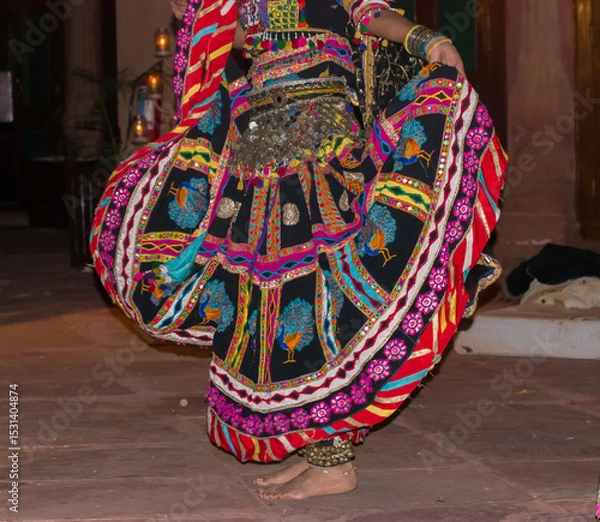 Obraz Beautiful Lehenga Skirt Movement During Kalbelia Dance by Rajasthani Dancer on stage during a performance. Rajasthan Tour concept. exploring local attractions in rural settings