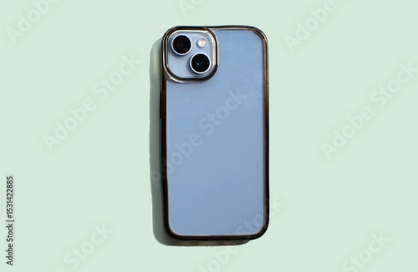 Fototapeta Transparent phone case shown on soft green background, highlighting clean and dirty surfaces, effectively demonstrating product condition and usage over time.