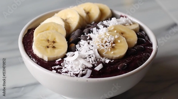Fototapeta Colorful acai bowl with banana slices and coconut flakes vibrant superfood breakfast white backdrop overlay cut out on isolated transparent removed background